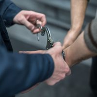 handcuffing the arrested person. Implementation of the arrest
